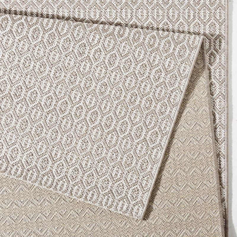 Beige indoor outdoor coin rug with woven geometric pattern perfect for indoor outdoor use
