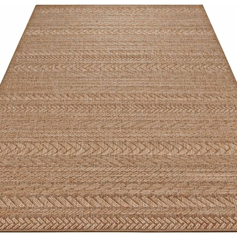 Beige indoor outdoor granado rug with a chevron sisal-look woven herringbone pattern perfect for any space