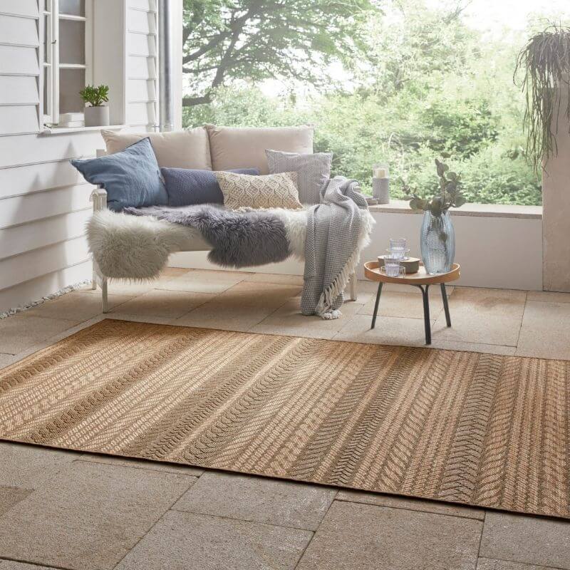 Natural fiber indoor outdoor granado rug with chevron sisal-look pattern in earthy beige and tan tones