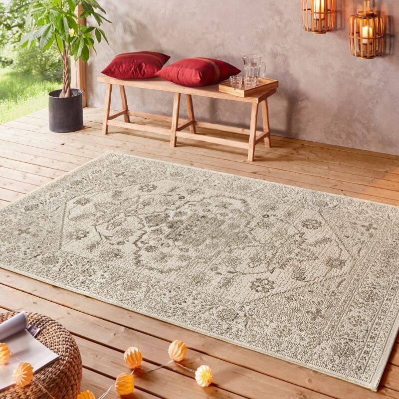 Beige indoor outdoor rug with vintage floral and geometric pattern in muted gray tones perfect for indoor outdoor use