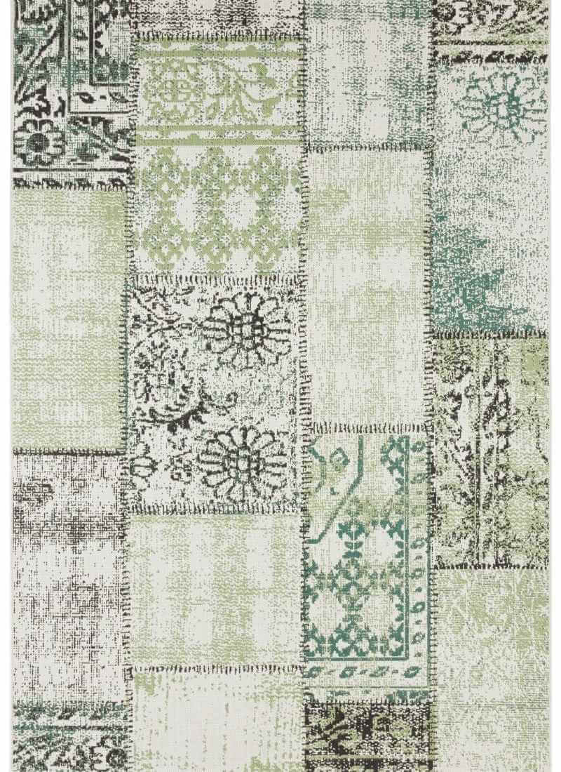Indoor outdoor symi patchwork rug with vintage distressed look and muted green beige ornate patterns