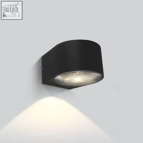Black die cast led wall light with frosted glass lens mounting indoor outdoor emitting warm white glow