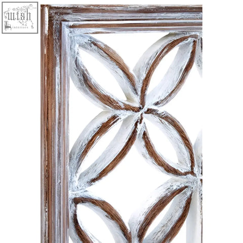 Distressed white and brown wooden framed wall mirror with antique white quatrefoil white lattice design