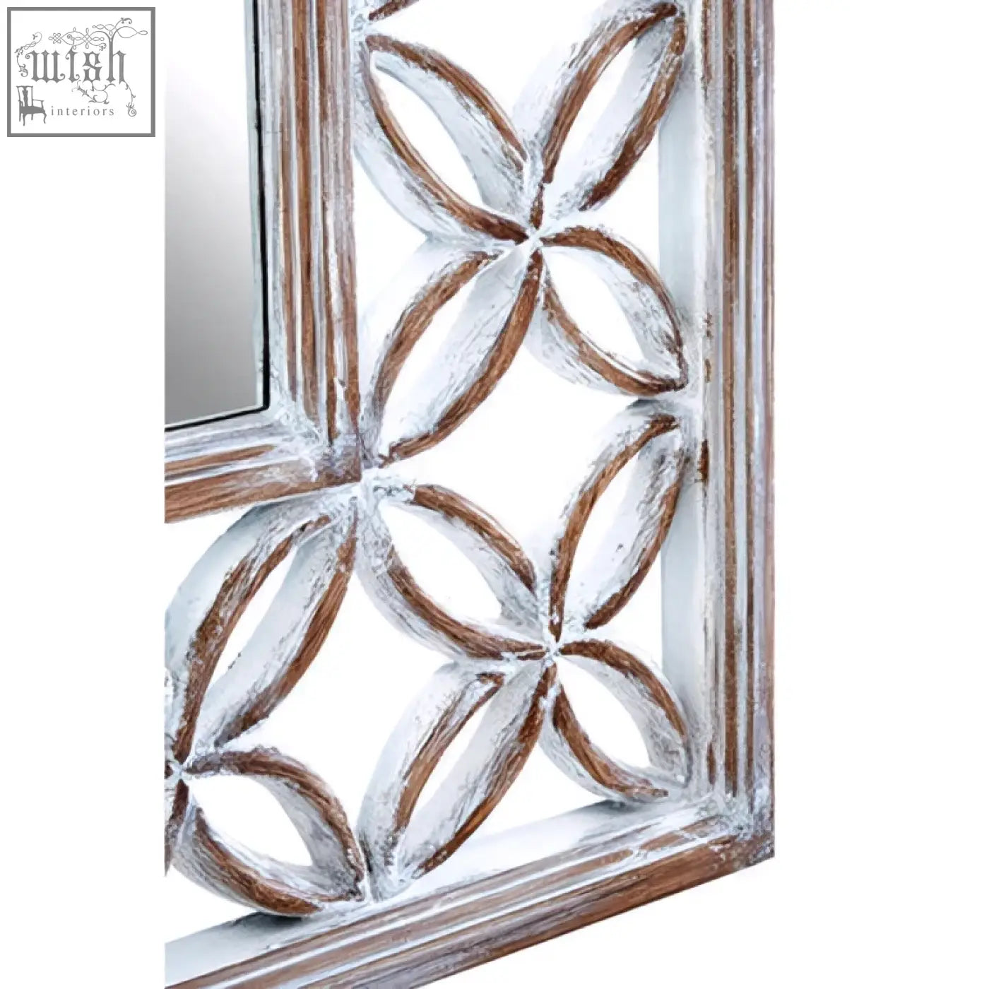 A rustic antique white wall mirror with a white lattice wooden frame featuring an interlocking oval pattern