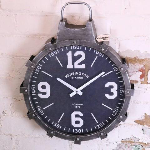 Industrial style wall clock with a dark navy face, bold white numerals, and rugged gunmetal grey metallic frame