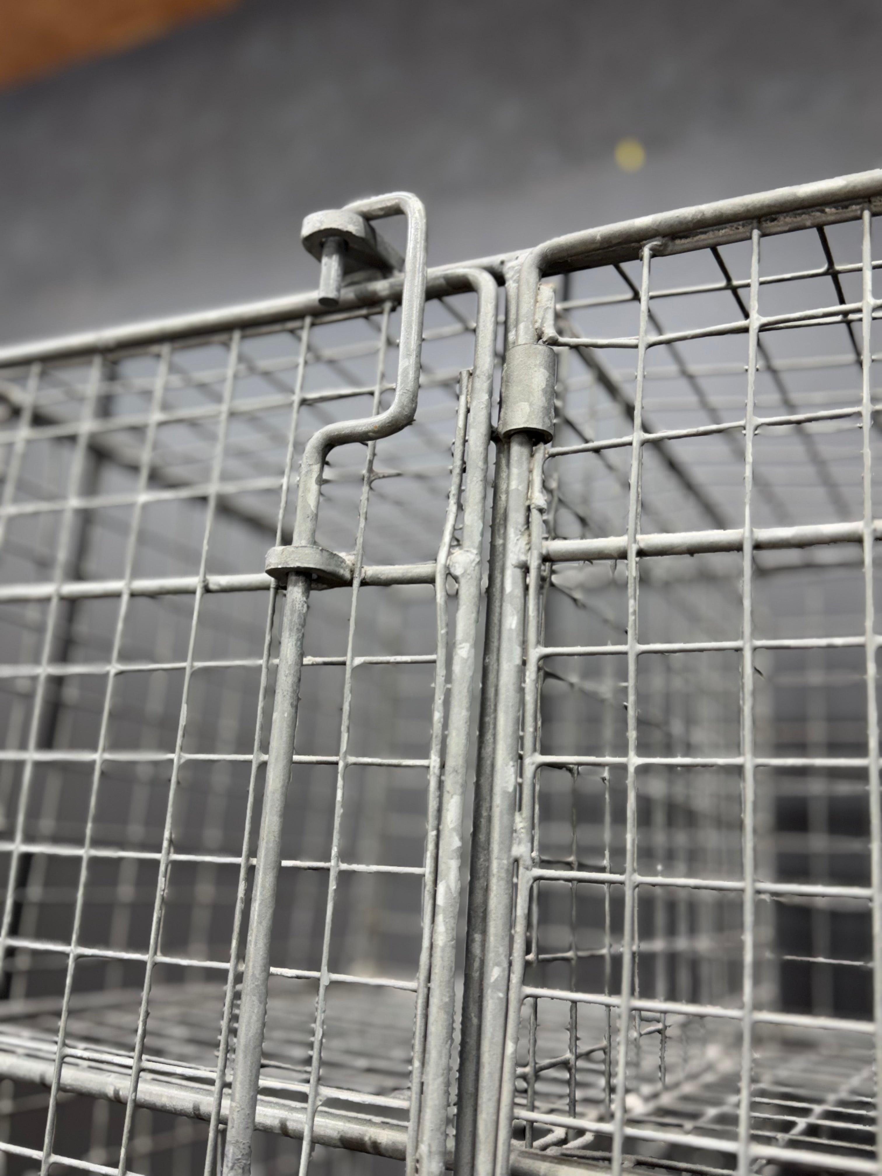 Gray metal wire mesh cage with latch mechanism for industrial vintage three door locker storage cabinet wardrobe