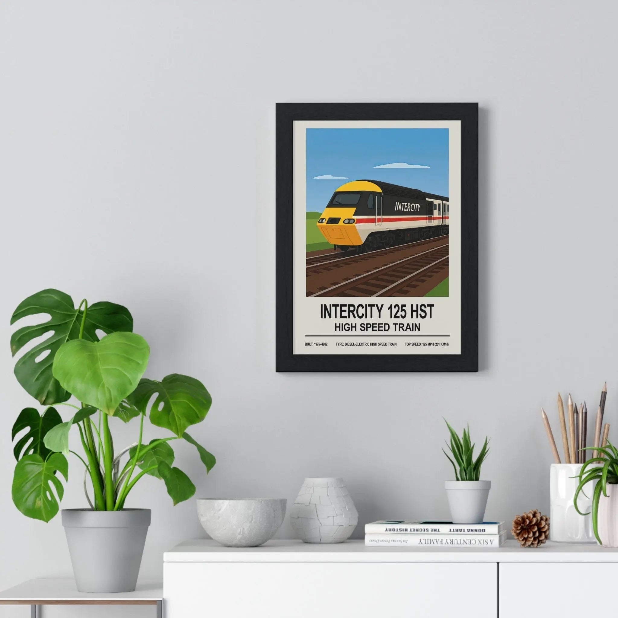 Black-framed hst poster featuring a stylized yellow and black intercity 125 high speed train illustration wall art