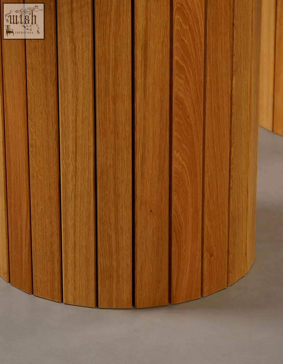 Ionescu oval dining table with cylindrical light brown oak wood base and marble dining top for dining room use