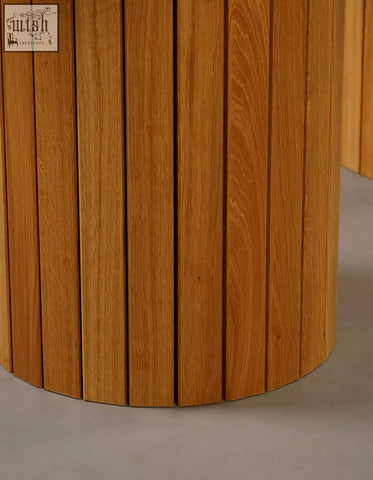 Ionescu oval dining table with cylindrical light brown oak wood base and marble dining top for dining room use