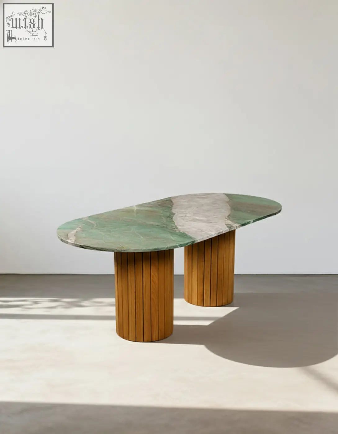 Elegant ionescu oval dining table with green and white marble top and wooden columns for stylish marble dining room