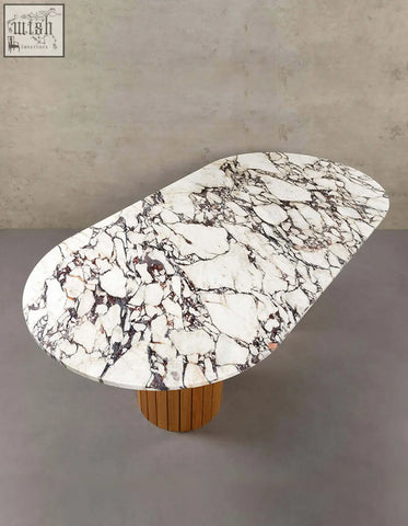 Elegant ionescu oval dining table with white marble top featuring black and reddish veins on wooden base perfect for dining room