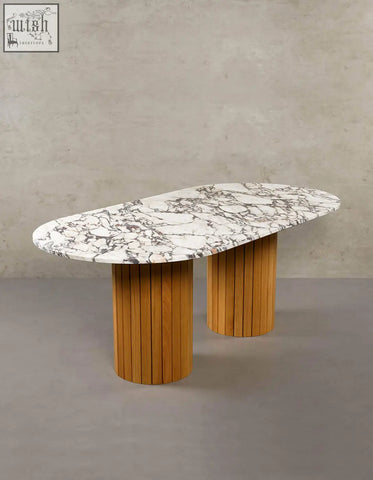 Ionescu oval dining table with white marble top and wooden slat legs perfect for a stylish marble dining room
