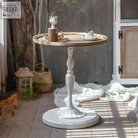 White distressed wood iphigenia retro side table with round top pedestal base and decorative turned legs and wrought iron accents