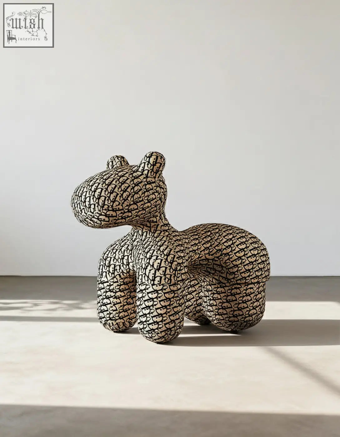 Isabeau kids animal armchair hippo shaped with black and white plush texture sits beside a coffee table set