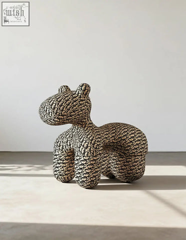 Isabeau kids animal armchair hippo shaped with black and white plush texture sits beside a coffee table set