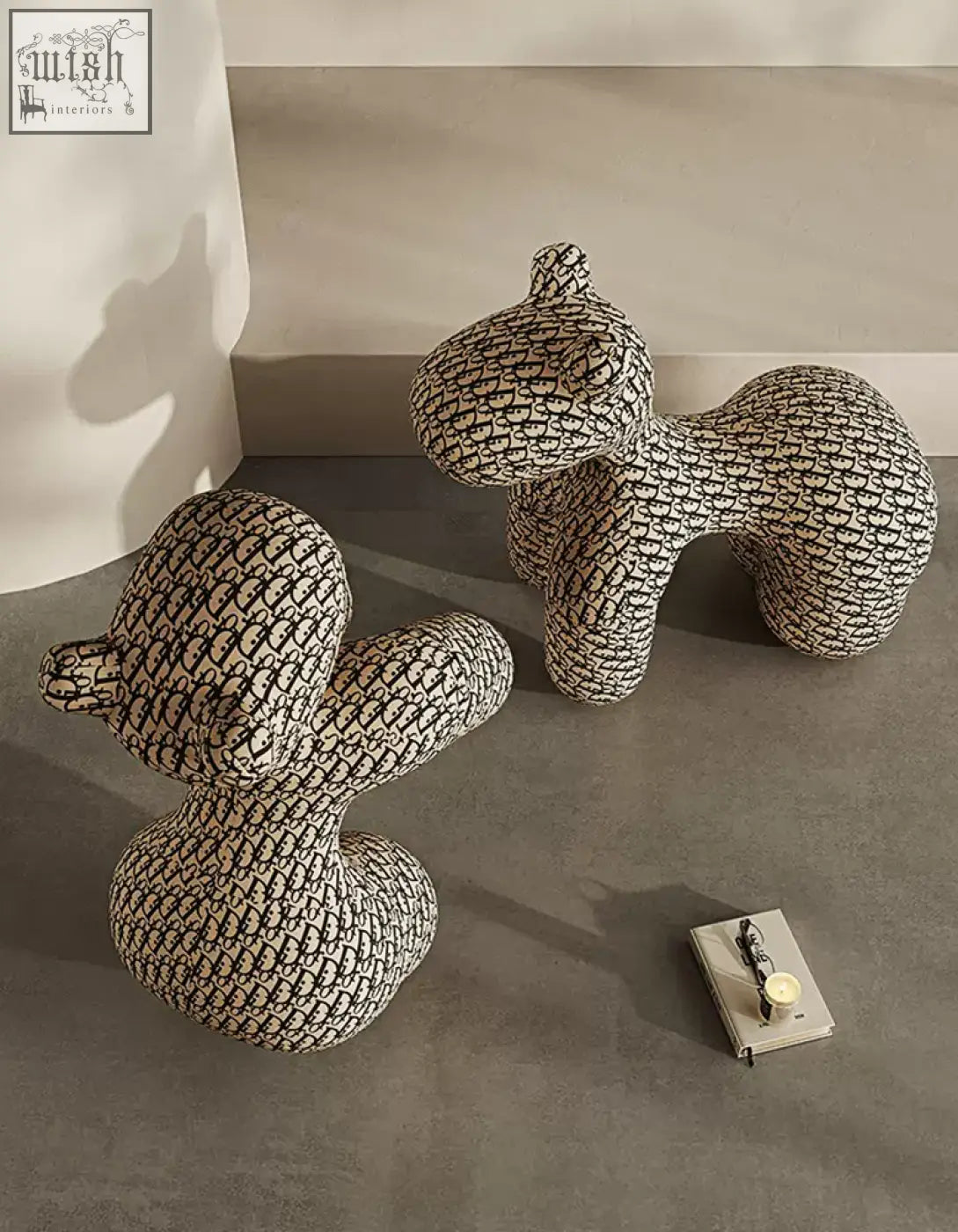Two plush black and white monogram dog-shaped isabeau kids animal armchairs perfect for a stylish coffee table set