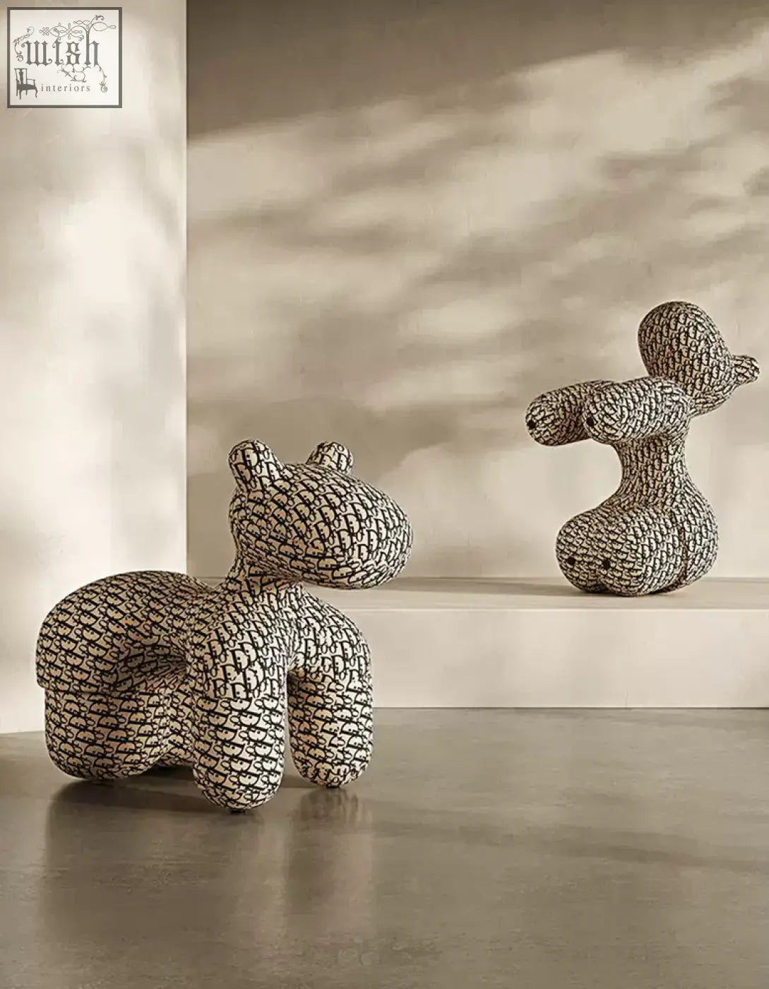 Two whimsical textured ceramic animal sculptures in monochrome pattern for isabeau kids animal armchair coffee table set