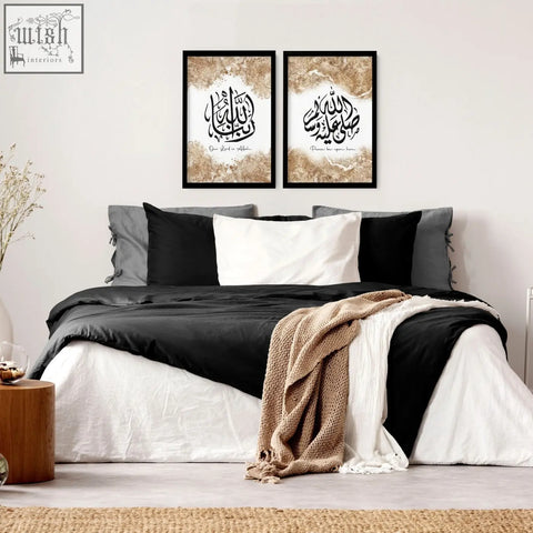 Black-framed islamic wall art prints with gold-foiled backgrounds set of 2 hanging above bed for bedroom decor