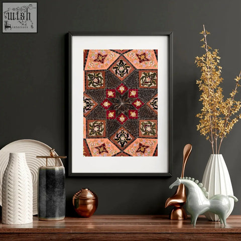 Black-framed wall art prints with terracotta and deep red Islamic geometry patterns perfect for bedroom decor