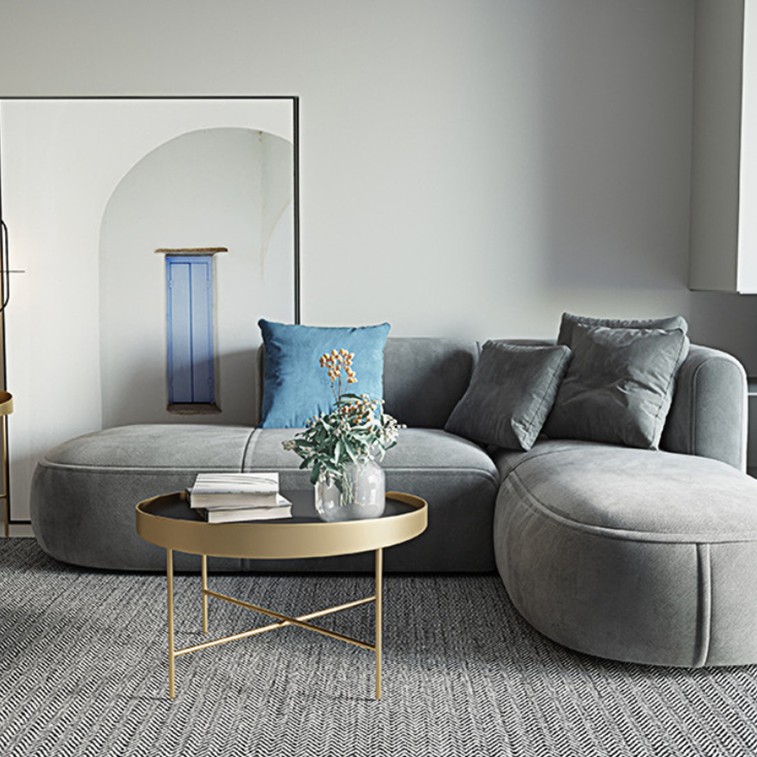 Gray velvet isolde three seater corner sofa with plush cushions and blue accent pillow in three seater corner design