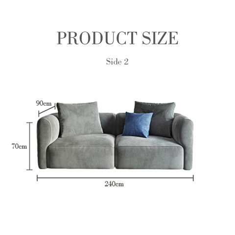 Isolde three seater corner sofa in grey velvet with plush armrests and a blue accent pillow for stylish seating