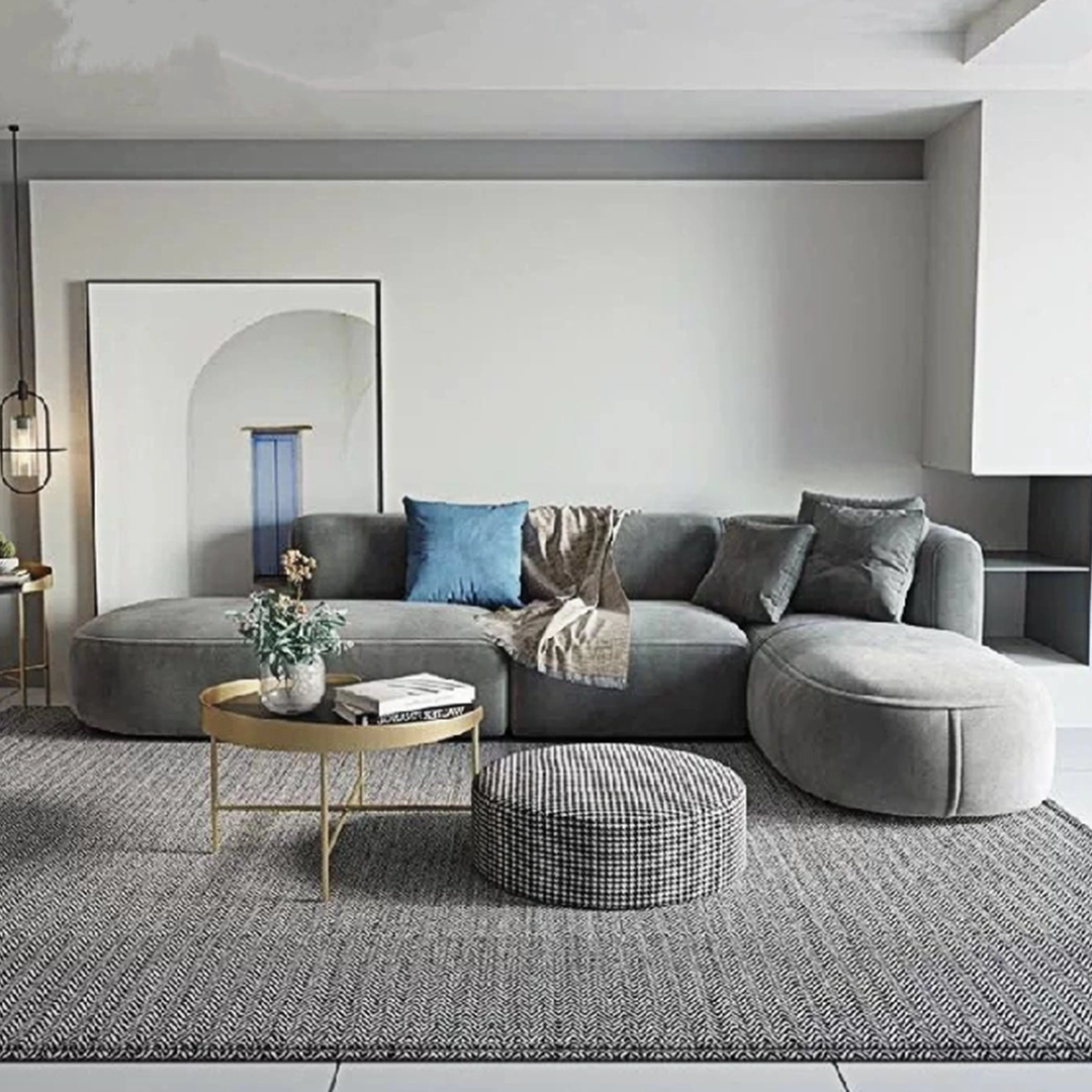 Modern gray velvet isolde three seater corner sofa with plush upholstery and rounded contemporary design