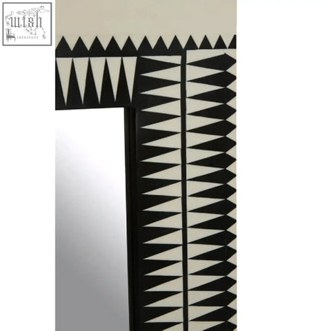Issey wall mirror with bold black and white geometric pattern frame perfect as a white wall mirror focal point
