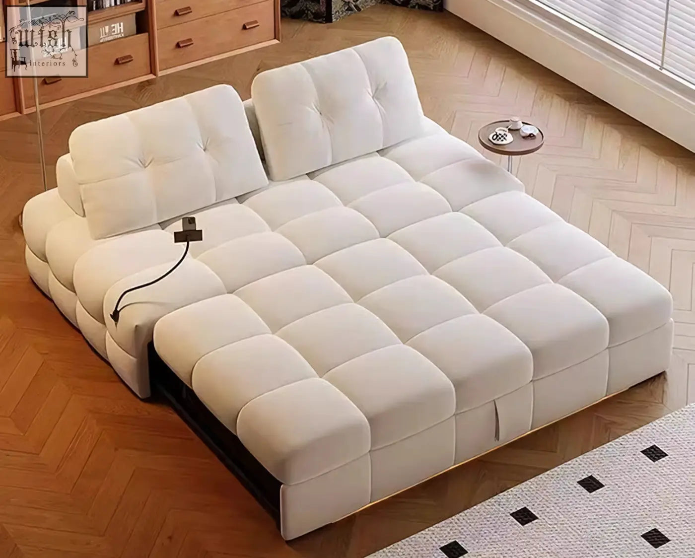 Cream-colored Ivanov two seater sofa bed with quilted cushions and sleek black base offering financing and low shipping cost