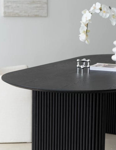 Black oval dining table with vertical ribbed legs solid wood ivar oval dining table with sleek modern design