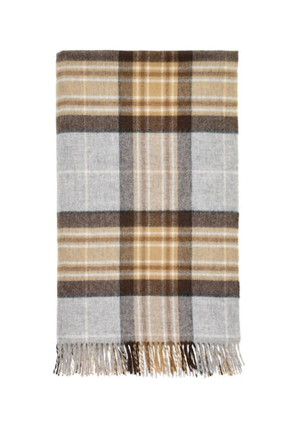 Ivy’s highland tartan plaid throw is a soft woolen blanket with beige brown and gray stripes and fringed edges