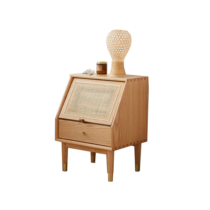 Light wood izabella bedside table with woven cane front panel and tapered legs in oak for bedroom use