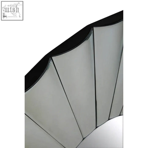 A sleek jade round silver wall mirror with a black frame and segmented silver reflective panels for modern decor