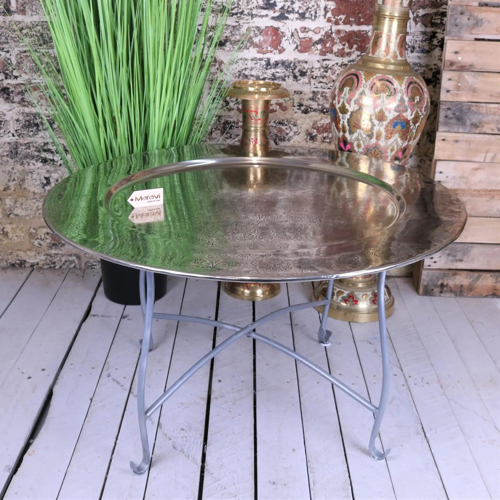 Antique-style brass moroccan tray table with intricate engravings on a slender metal stand 80cm jadida model
