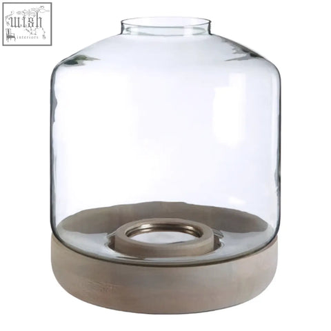 Clear glass jain large hurricane candle holder with matte gray concrete base and metallic ring for large hurricane candle use
