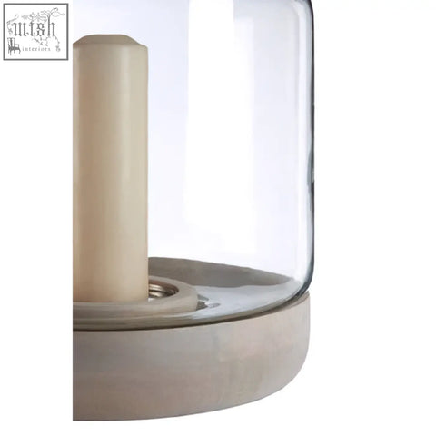 Clear glass jain large hurricane candle holder with beige cylindrical holder and matte gray concrete base
