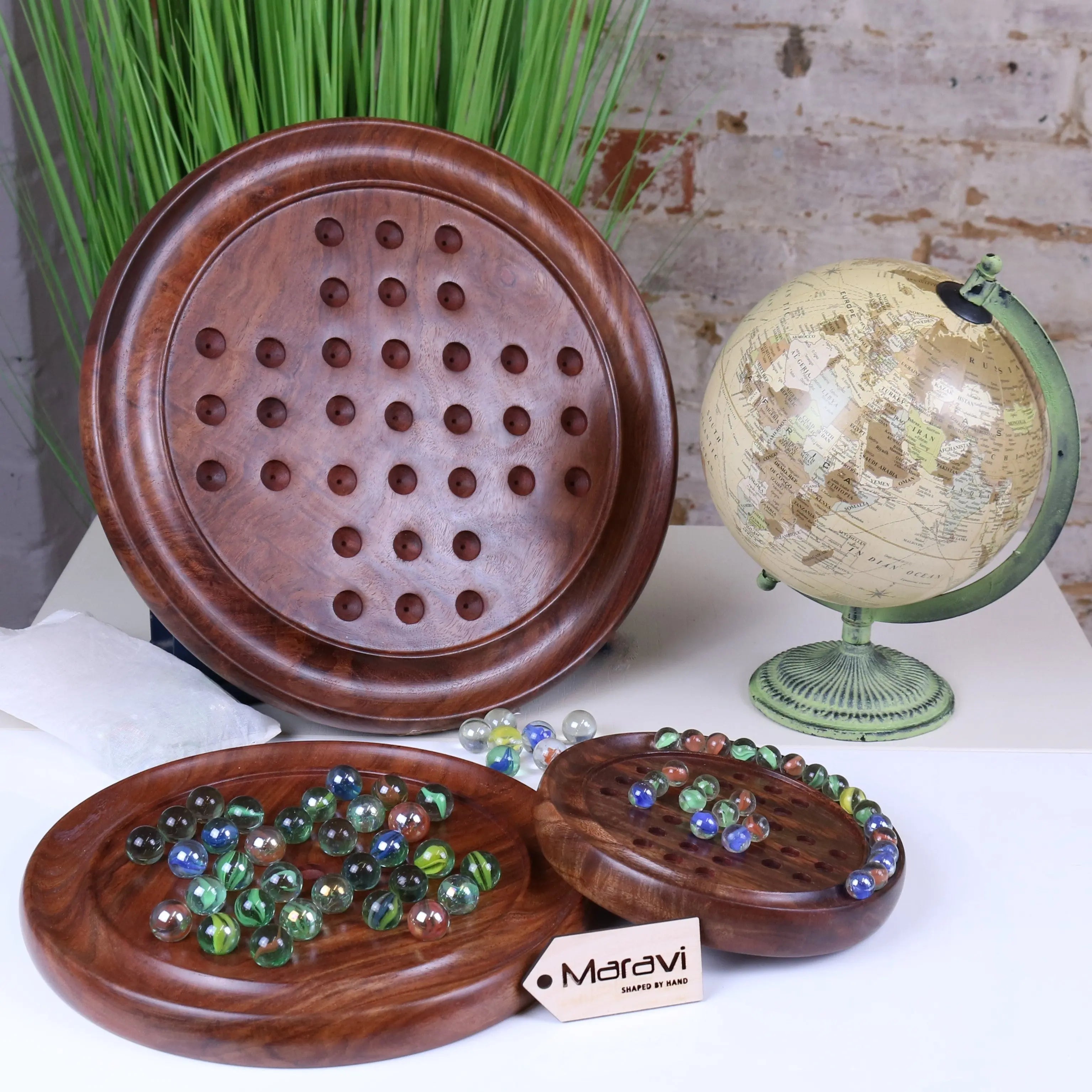 Handcrafted jajur wooden solitaire game with rich brown finish and colorful glass marbles for classic solitaire game fun