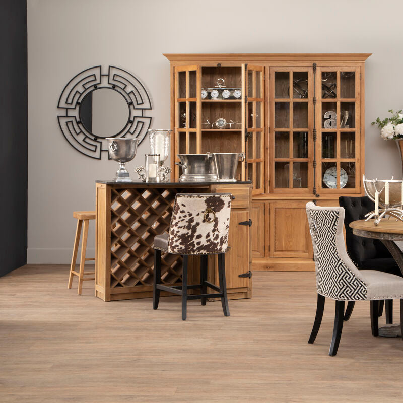 Wooden wine rack with a dark countertop and jalal black metal frame round wall mirror with black metal frame accents