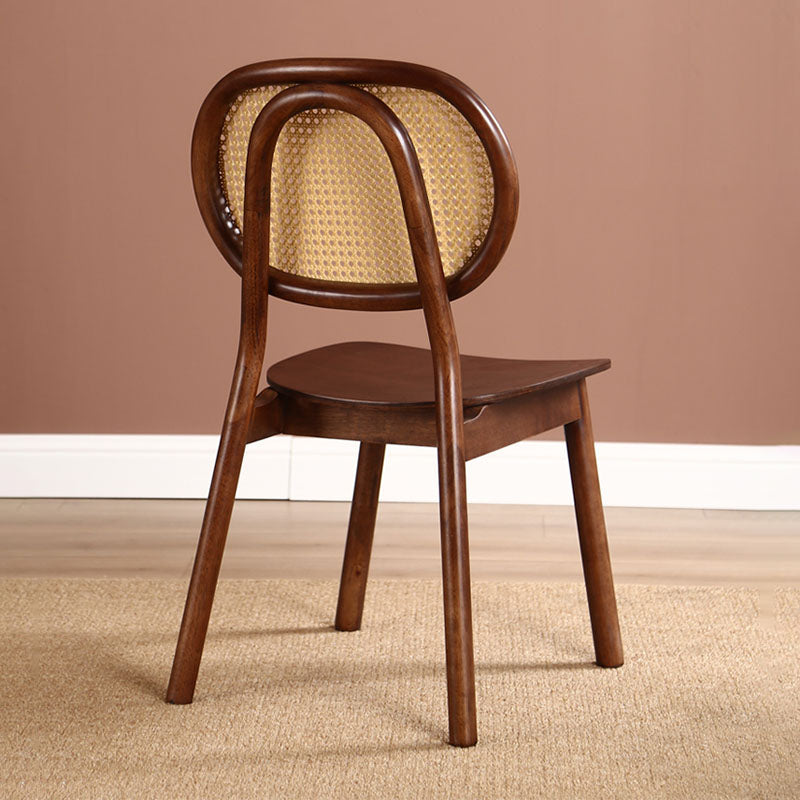 Dark brown james rattan dining chair with curved solid wood backrest and woven cane seat for stylish dining