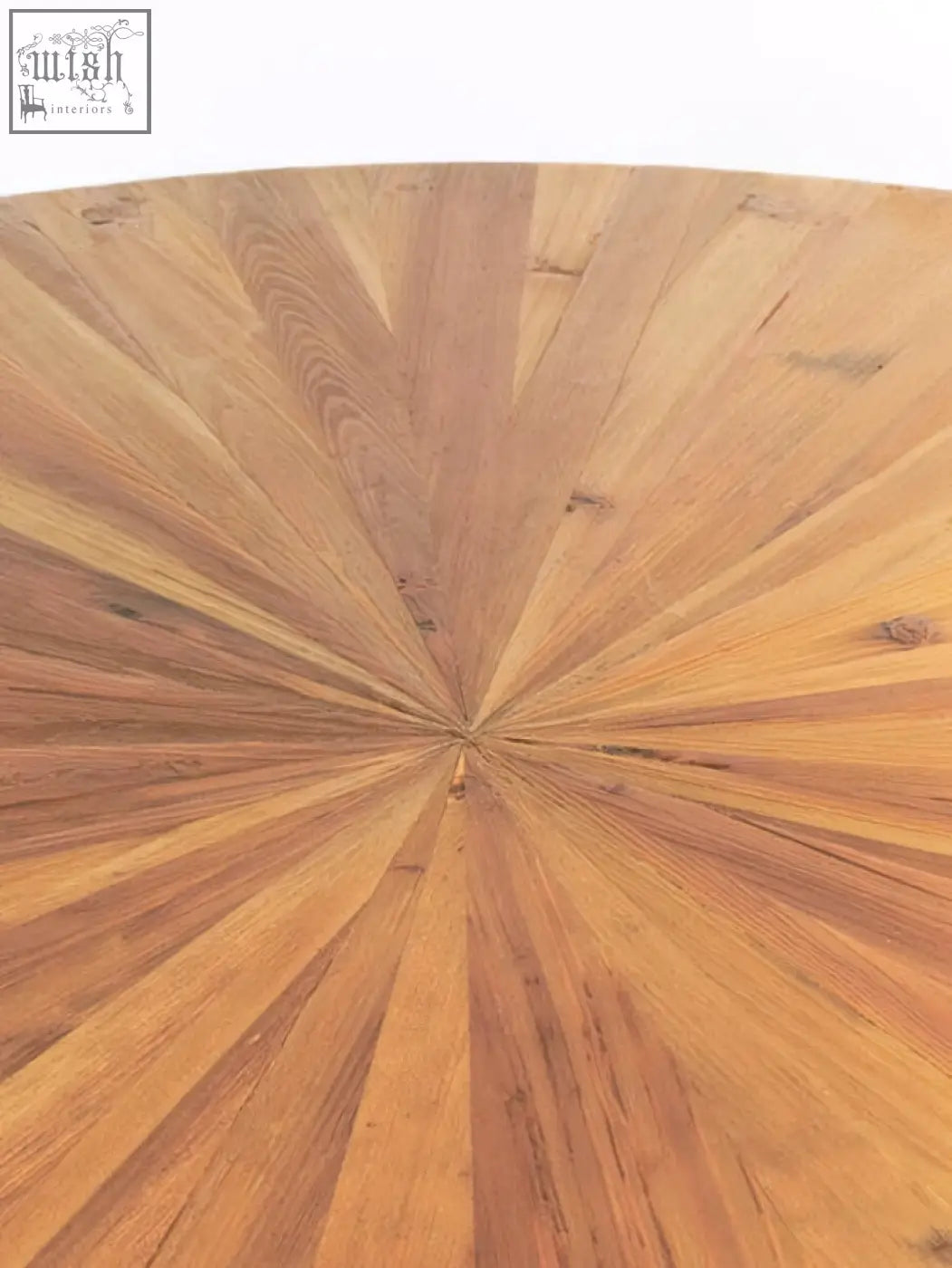 Jana round fir wood dining table with a circular sunburst pattern top made of light to medium-toned fir wood planks