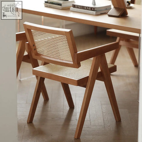 Minimalist jane rattan dining chair with woven cane back and seat in natural wood tones solid wood design