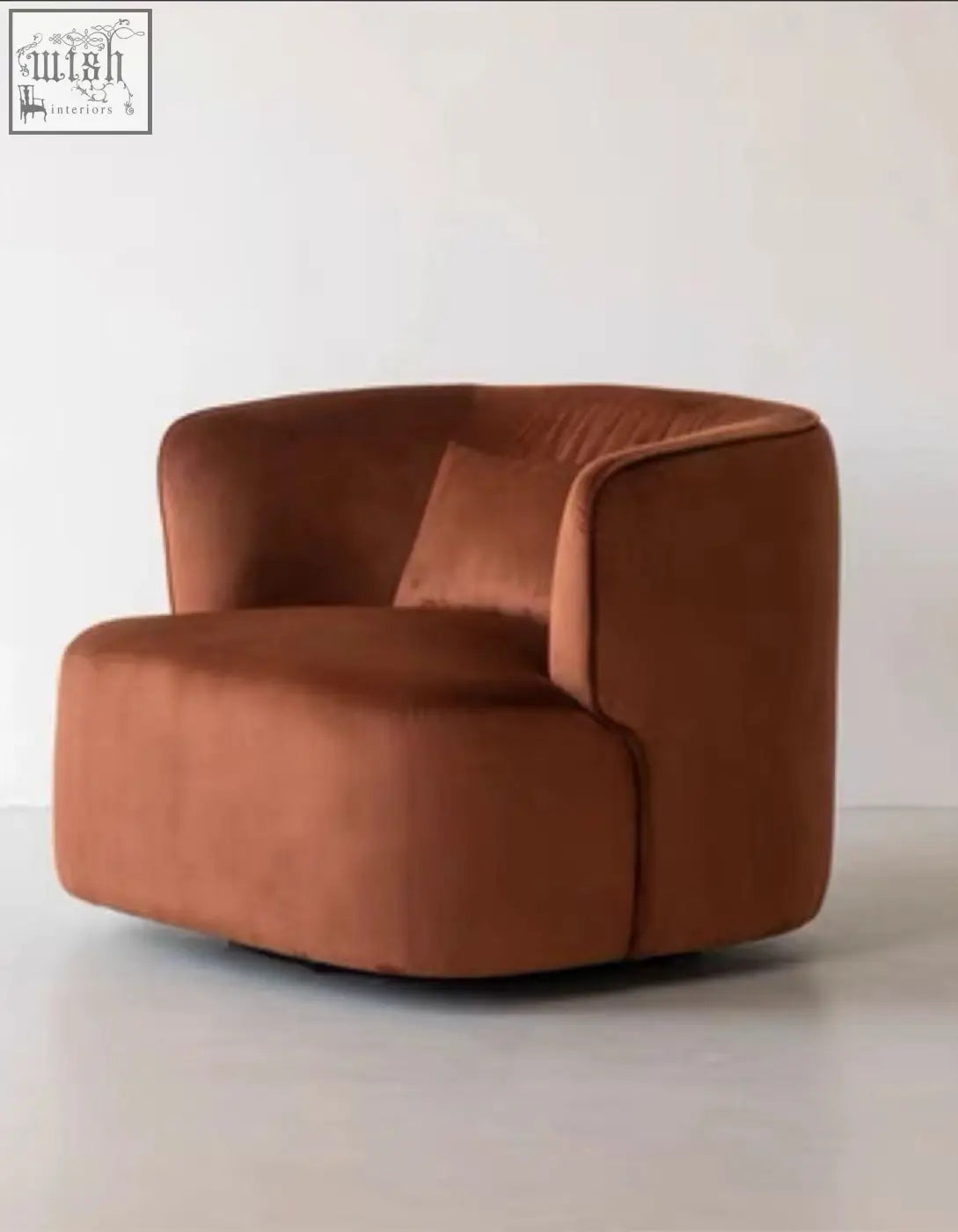 Janet armchair velvet bouclé with cozy rounded design in rich rust color unlike typical green velvet armchair styles