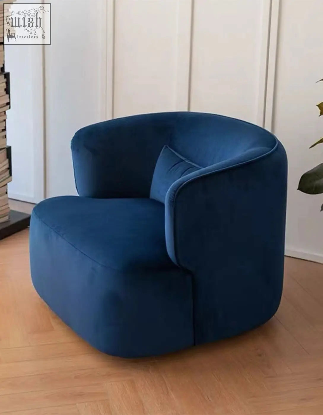 Deep blue velvet armchair janet armchair with rounded modern design and matching cushion perfect for cozy seating
