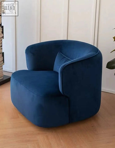 Deep blue velvet armchair janet armchair with rounded modern design and matching cushion perfect for cozy seating