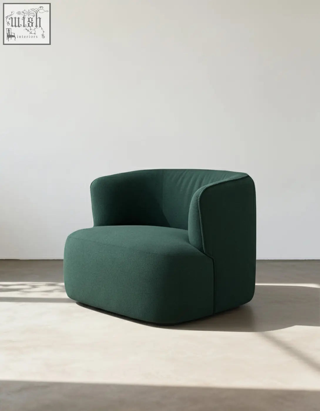 Deep emerald green velvet armchair janet armchair with soft rounded contours and minimalist design