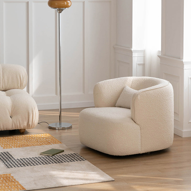 Cream-colored jaotoo armchair with plush rounded shape and soft boucle velvet fabric for cozy seating