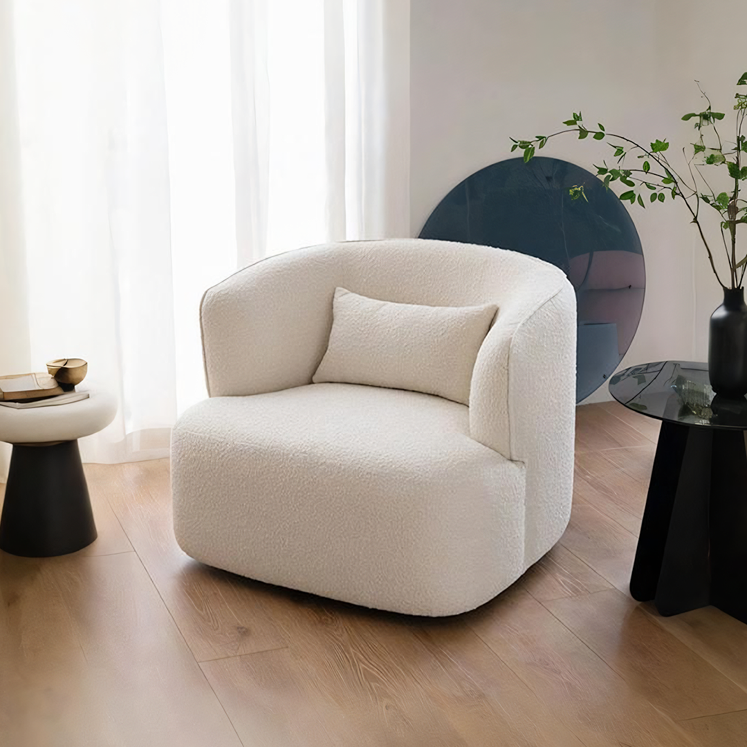 Cream-colored plush sheepskin-like jaotoo armchair with matching cushion in velvet boucle fabric for cozy seating