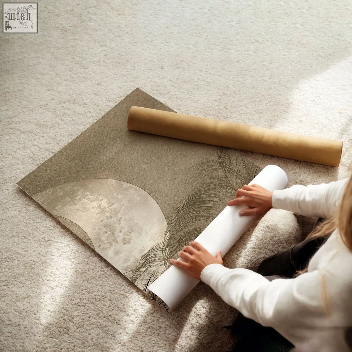 Beige and silver abstract living room canvas art featuring textured moon and feather design unrolled on carpeted floor