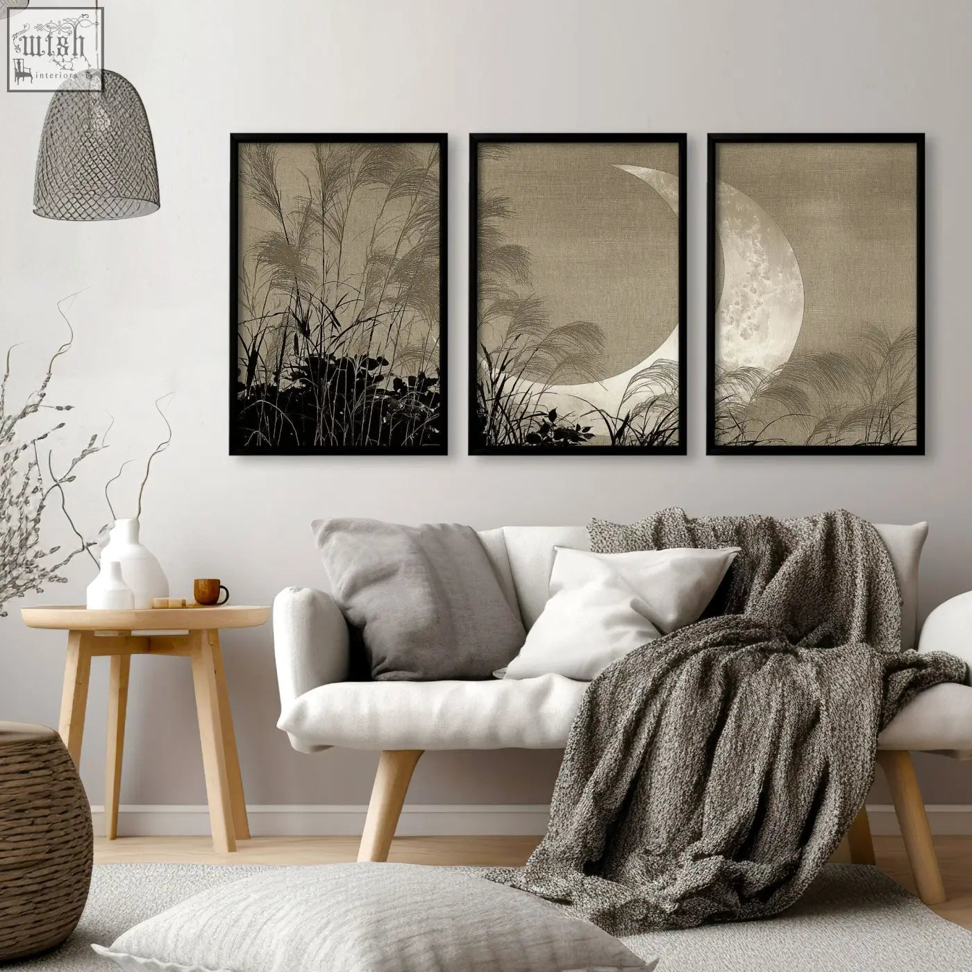Three framed black and white japandi crescent moon and pampas grass living room canvas art above white sofa