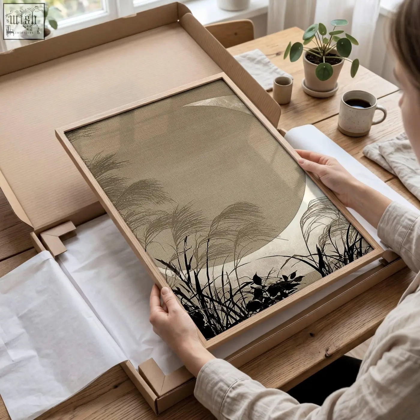 Minimalist living room canvas art set featuring black reed silhouettes on beige textured background in light wood frame