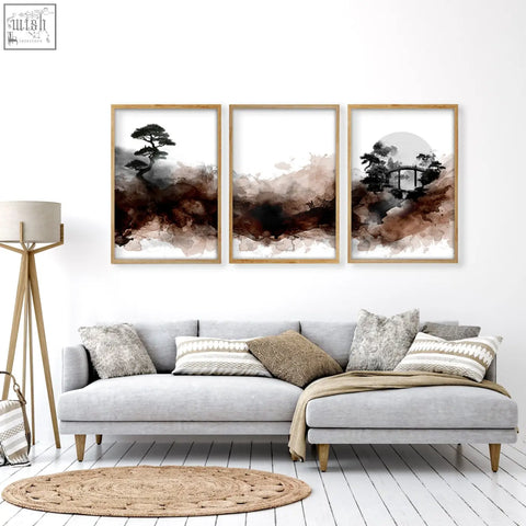 Three framed ink wash wall art pieces with minimalist bonsai bridge and moon scenes in brown tones for living room